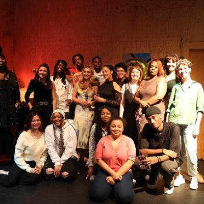 A large group of people posing for a picture in the Young Vic Studio Space