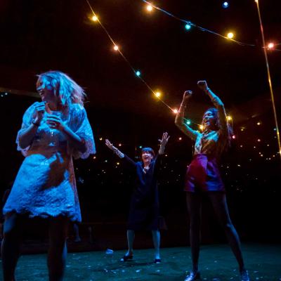 Billie Piper, Maureen Beattie and Thalissa Teixeria in a party scene in Yerma at the Young Vic. Photo by Johan Persson