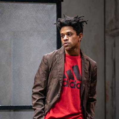 Jeremy Pope in The Collaboration (c) Marc Brenner. Basquiat, looking disinterested, with his hands in his pockets 