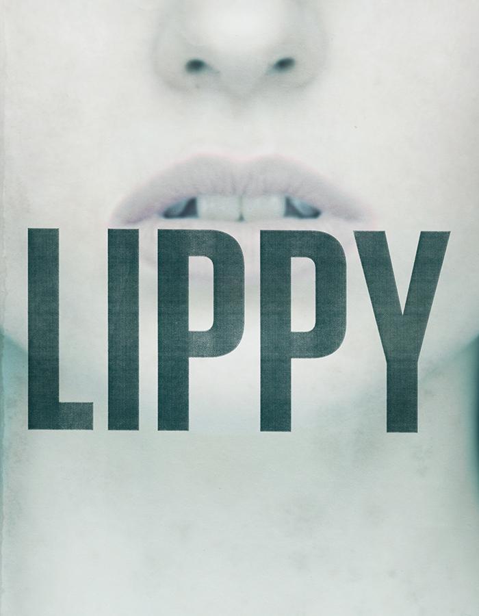 A very pale women's nose and mouth with word Lippy over her mouth