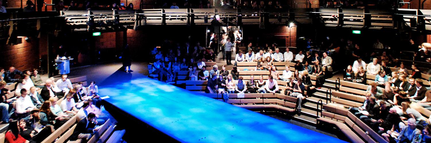 Interior of Young Vic auditorium with audience members before a performance