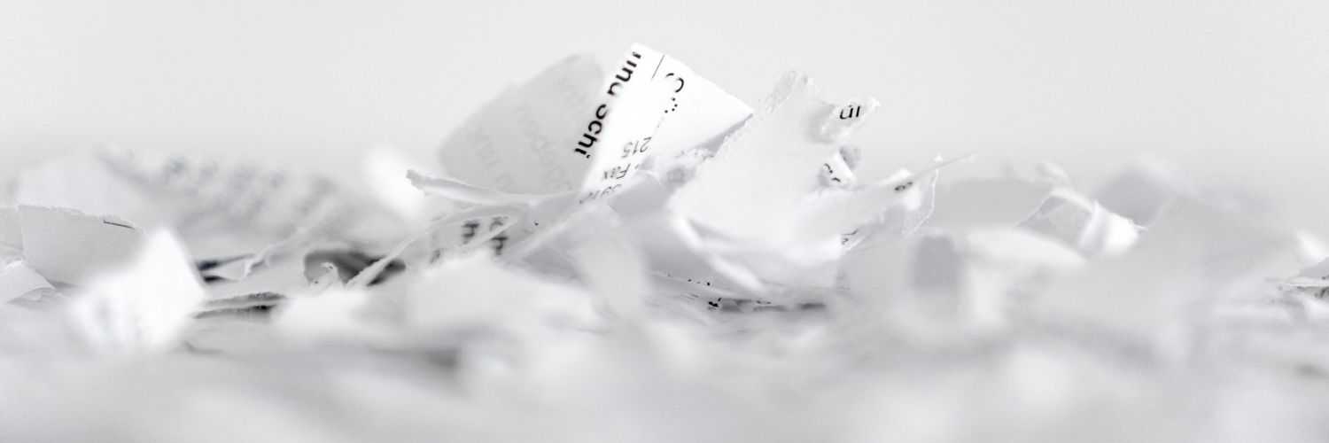 Some papers shredded and crumpled up. The contents are unreadable.