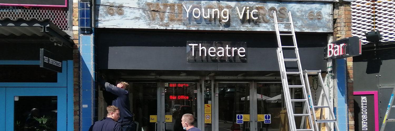 Exterior of Young Vic with a ladder against the wall and workmen