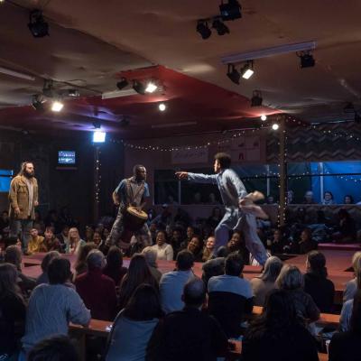 Ammar Haj Ahmad (Safi) John Pfumojena (Okot) Mohammad Amiri (Norullah) in The Jungle at the Young Vic © Leon Puplett