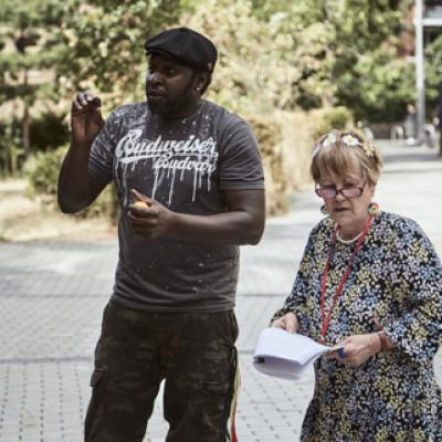 Two people standing outside