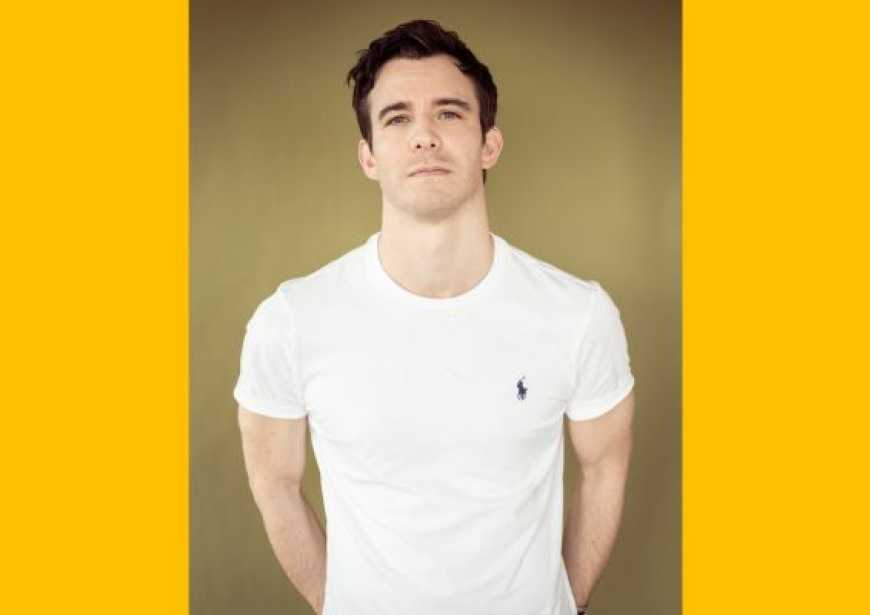 A headshot of Luke Thompson