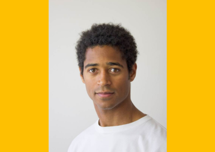 A headshot of Alfred Enoch