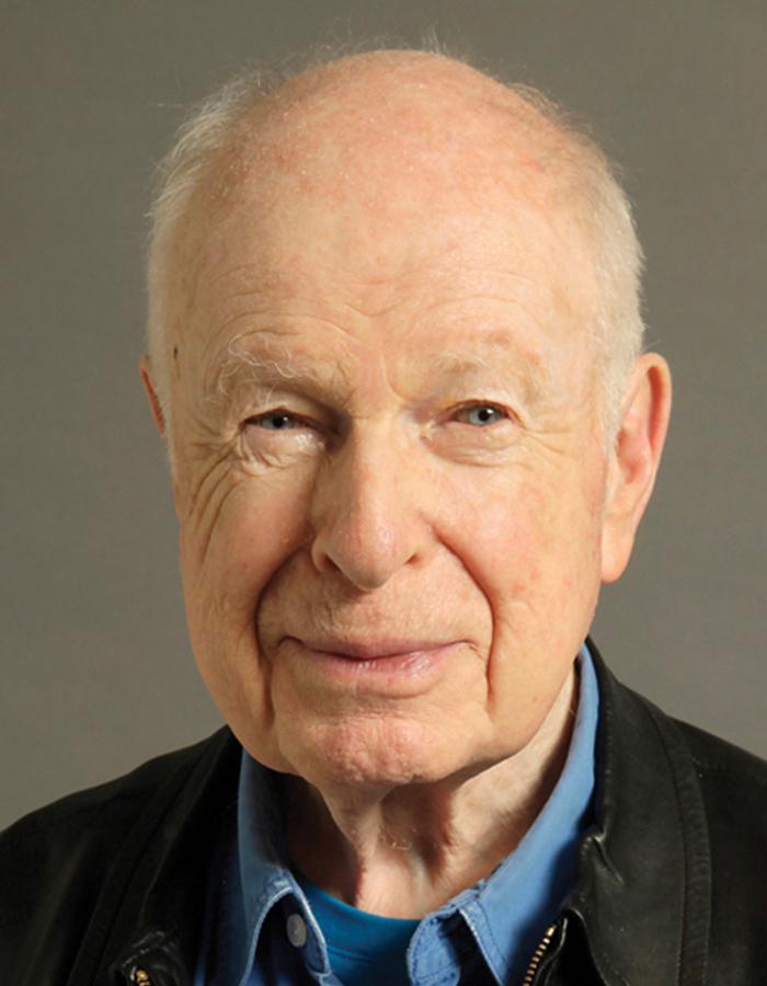 Portrait of a smiling Peter Brook by  Régis d’Audeville