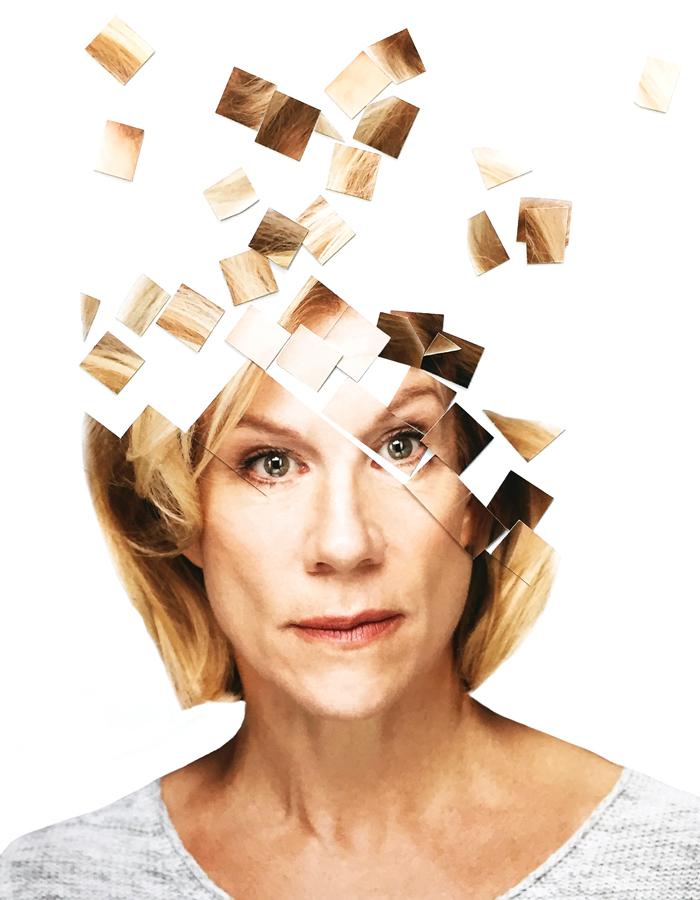 Portrait of Juliet Stevenson in front of a white background with the top of her fragmented into square puzzle pieces