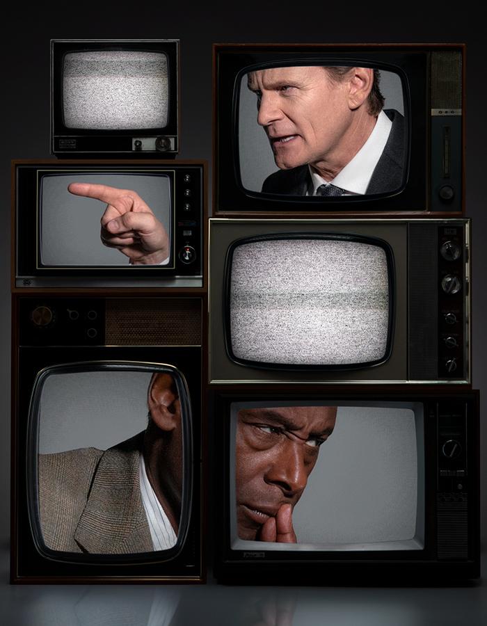 6 1960s TVs stacked on top of each other. David Harewood is split across 2 TVs and Charles Edwards in pointng at him, also split across 2 TVs. There is white noise on the other screens