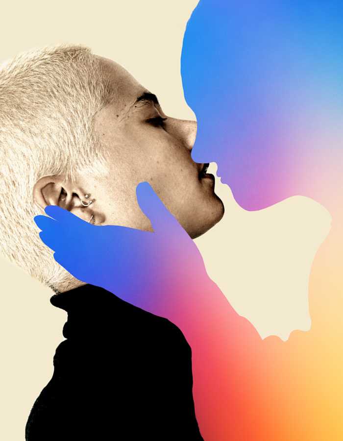 The side profile of a person with short cropped hair and multiple earrings in their ear. They are leaning up to almost kiss a blue and purple silhouette of a person. The silhouette person has a hand extended to cup the side of the other person's face.