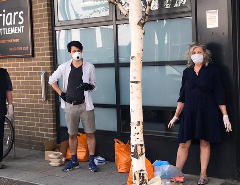 A group of volunteers stand outside Blackfriars Settlement office