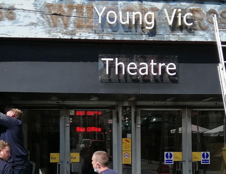 Exterior of Young Vic with a ladder against the wall and workmen