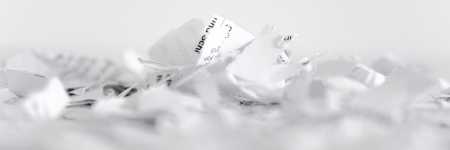 Some papers shredded and crumpled up. The contents are unreadable.