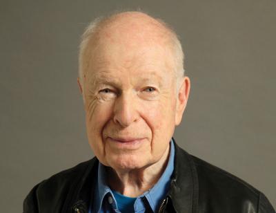Portrait of a smiling Peter Brook by  Régis d’Audeville