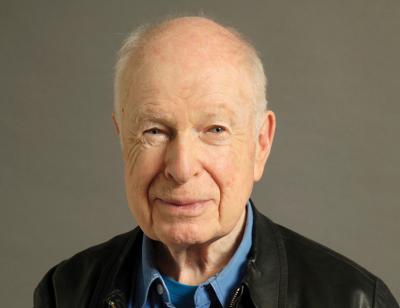 Portrait of a smiling Peter Brook by  Régis d’Audeville