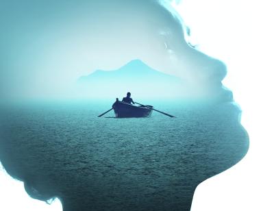 Further than the Furthest Thing, From 9th March to 29th April 2023. A blue-hued side view of a woman with curly hair looking up, with an overlaid image of a person in a boat rowing towards an island. 