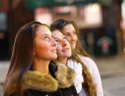 3 girls looking up into the distance